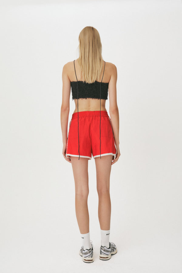 Enavant Lace trim track short in the color Red