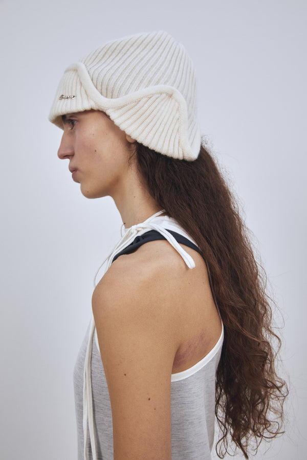 Enavant MERINO WOOL EARFLAP KNIT BEANIE in the color Ivory