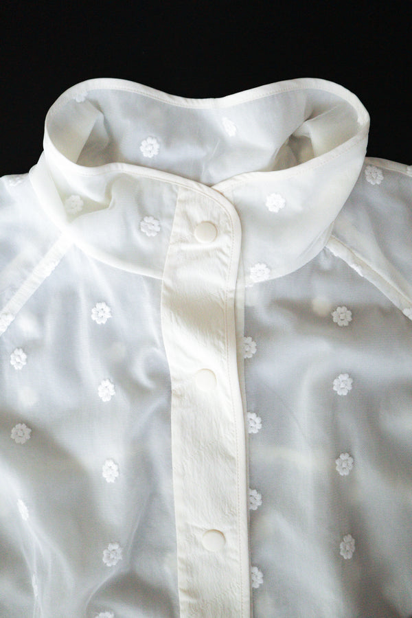 Enavant Sheer lace layered button-up windbreaker in the color Ivory