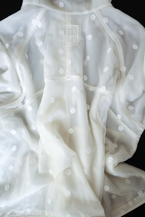 Enavant Sheer lace layered button-up windbreaker in the color Ivory