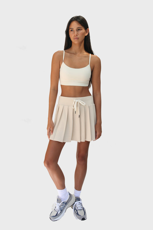 Enavant DYLAN PLEATED SKIRT in the color Coconut Beige