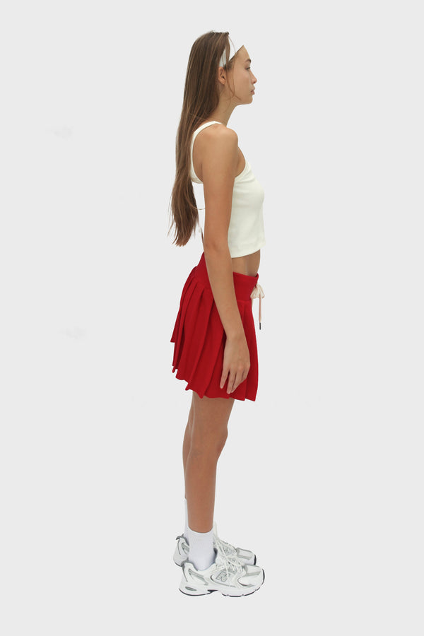 Enavant DYLAN PLEATED SKIRT in the color Red