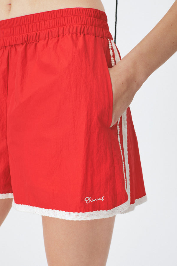 Enavant Lace trim track short in the color Red