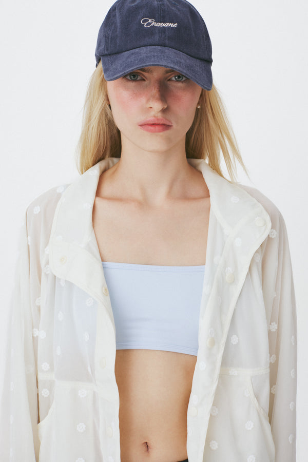 Enavant Sheer lace layered button-up windbreaker in the color Ivory