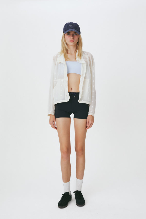 Enavant Sheer lace layered button-up windbreaker in the color Ivory