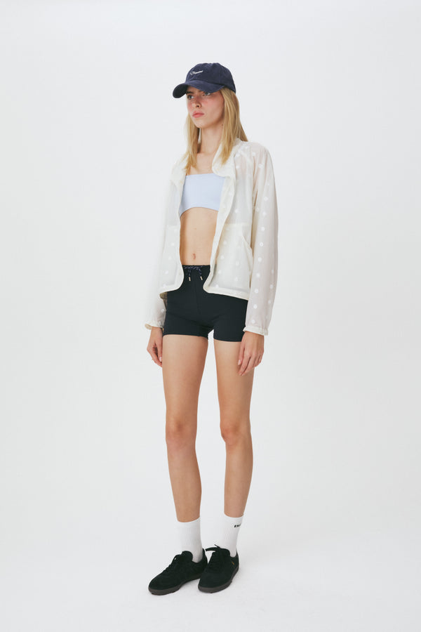 Enavant Sheer lace layered button-up windbreaker in the color Ivory