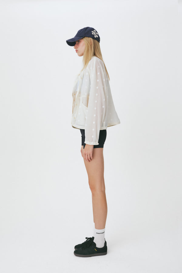 Enavant Sheer lace layered button-up windbreaker in the color Ivory