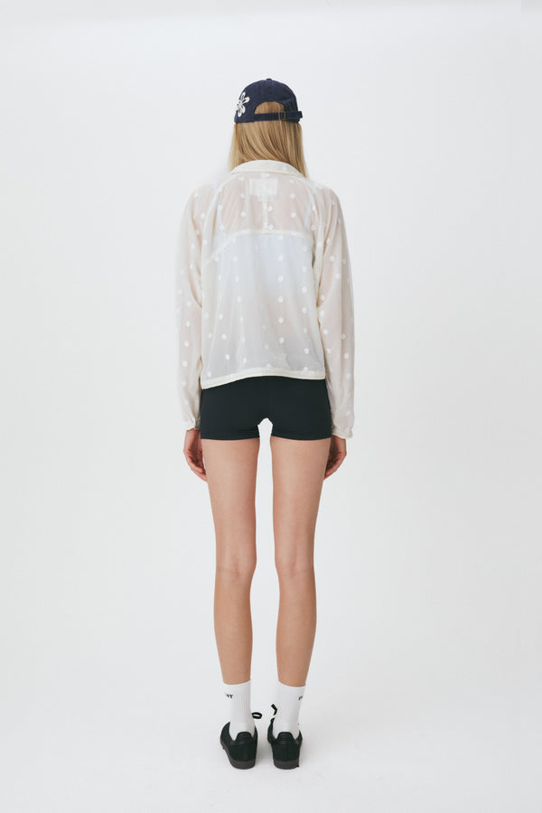 Enavant Sheer lace layered button-up windbreaker in the color Ivory