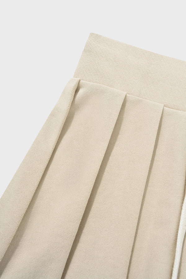 Enavant DYLAN PLEATED SKIRT in the color Coconut Beige